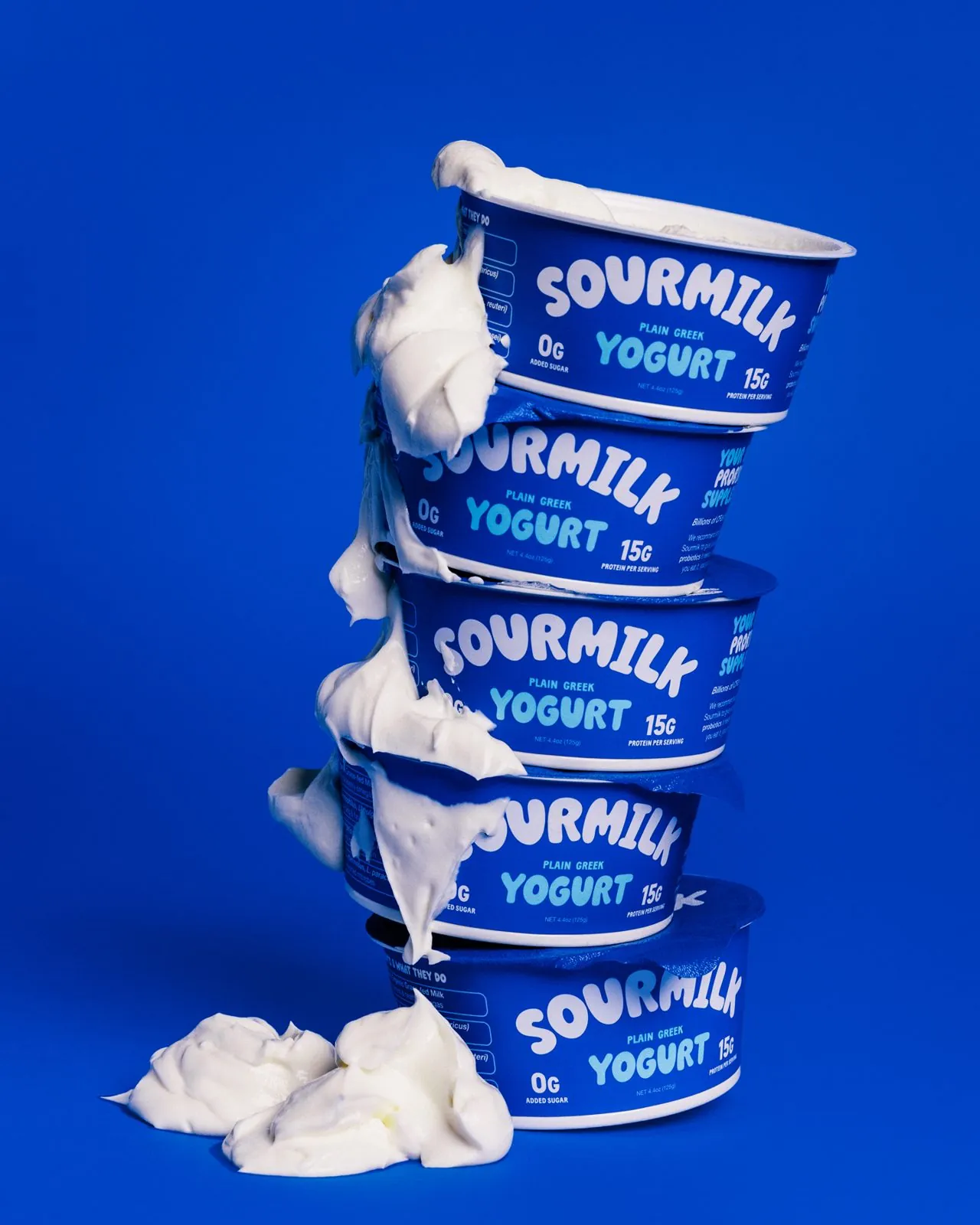 Yogurt dripping down a stack of cups
